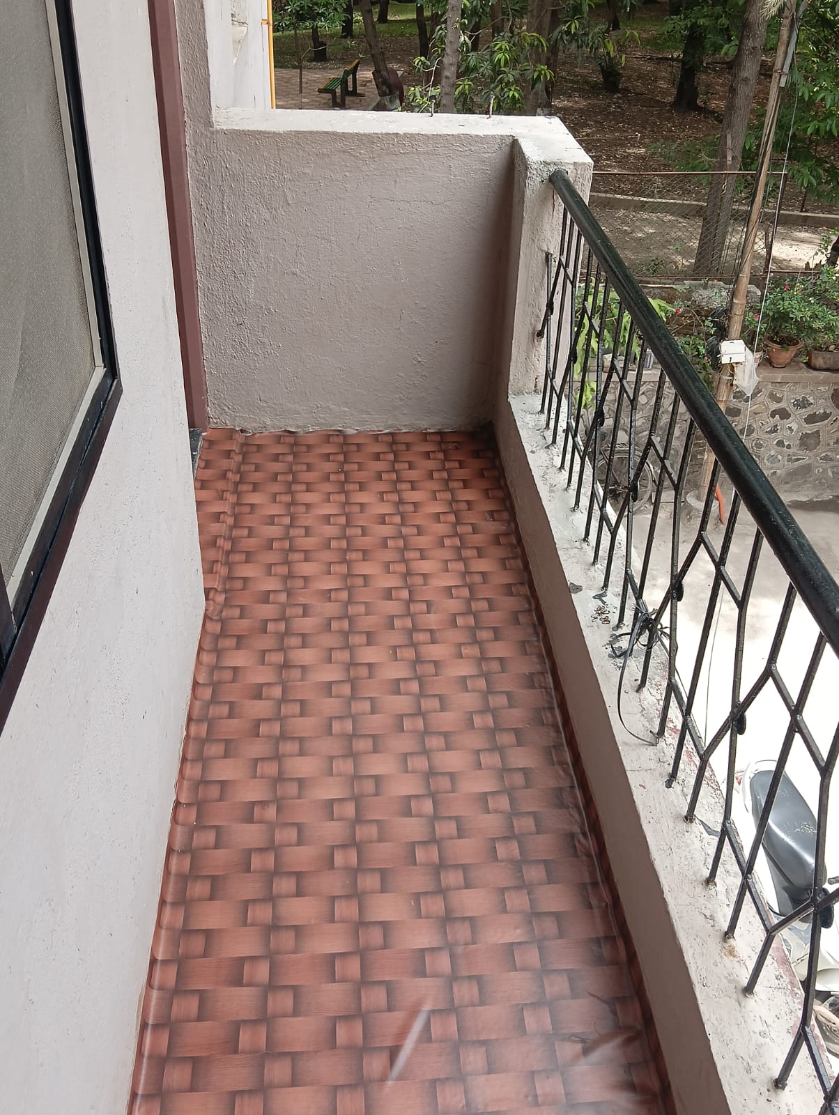 Open balcony with garden and trees at Queen Quatters PG Sector 26 Nigdi Pune