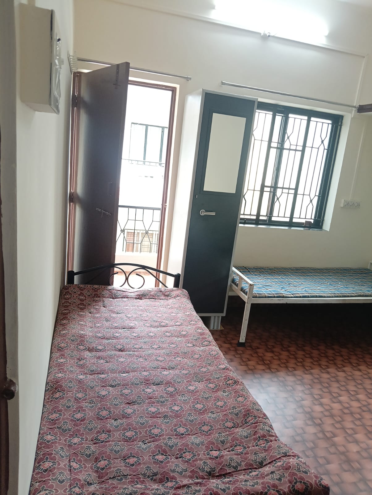 Double sharing room with two beds at Queen Quatters PG near PCCOE